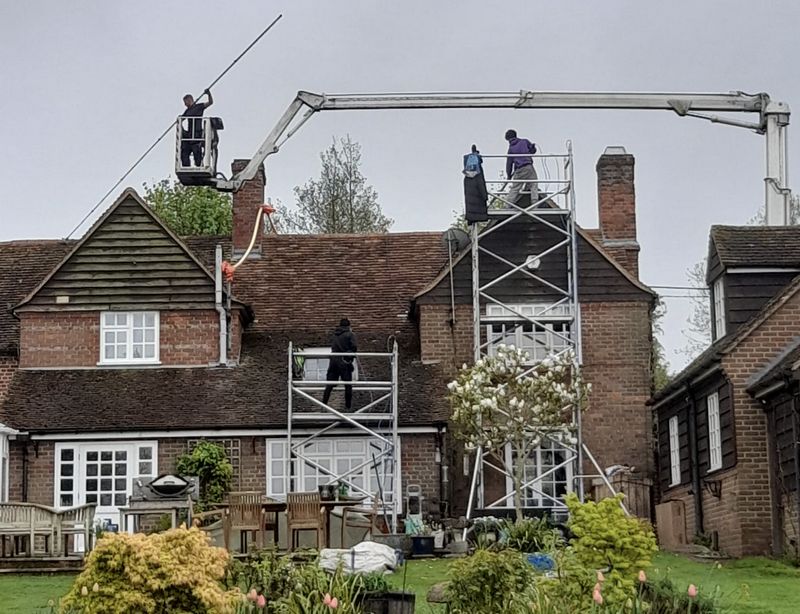 The Roof Moss Cleaners using cherry picker and scaffolding to clean roof safely and professionally in Bishops Stortford, Hertfordshire